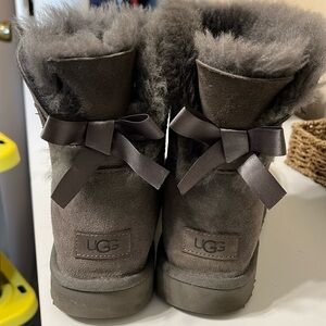 Women’s size 10 UGG boots with bow back. gray and color use but like new